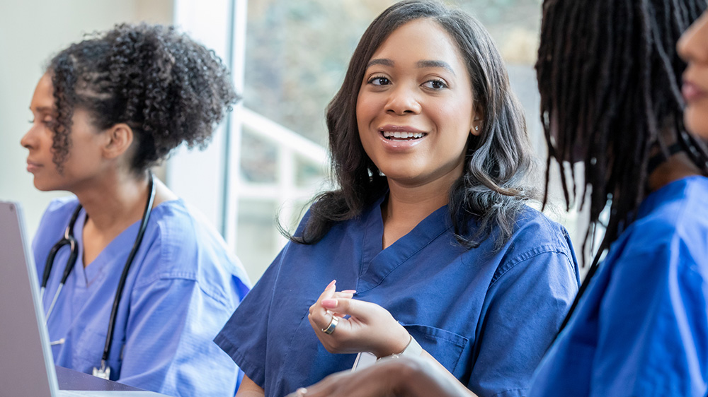 nurse smiling in the classroom.