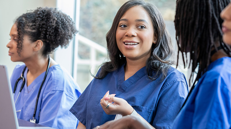 nurse smiling in the classroom.