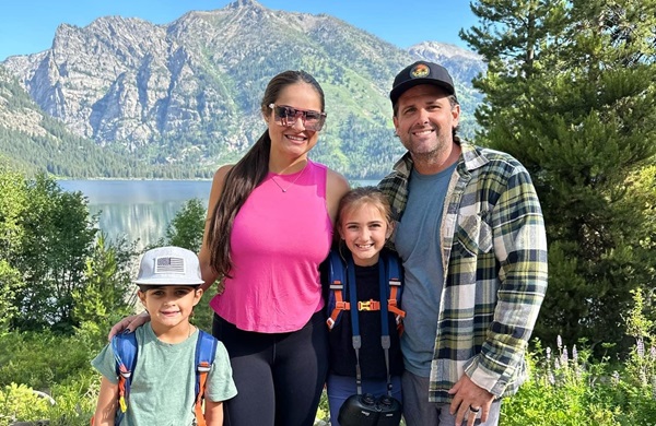 Gornall family photo in front of mountain and lake