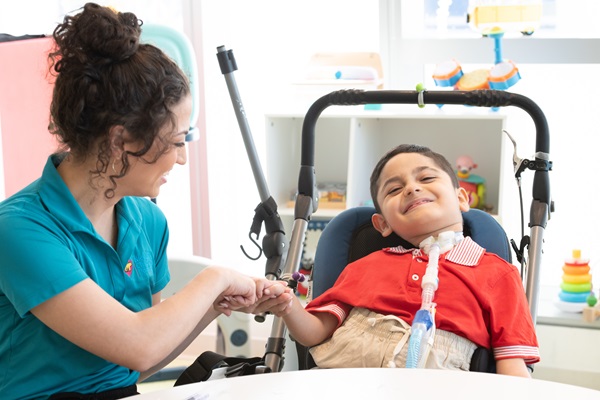 Patient Santi with female Nicklaus Children's employee